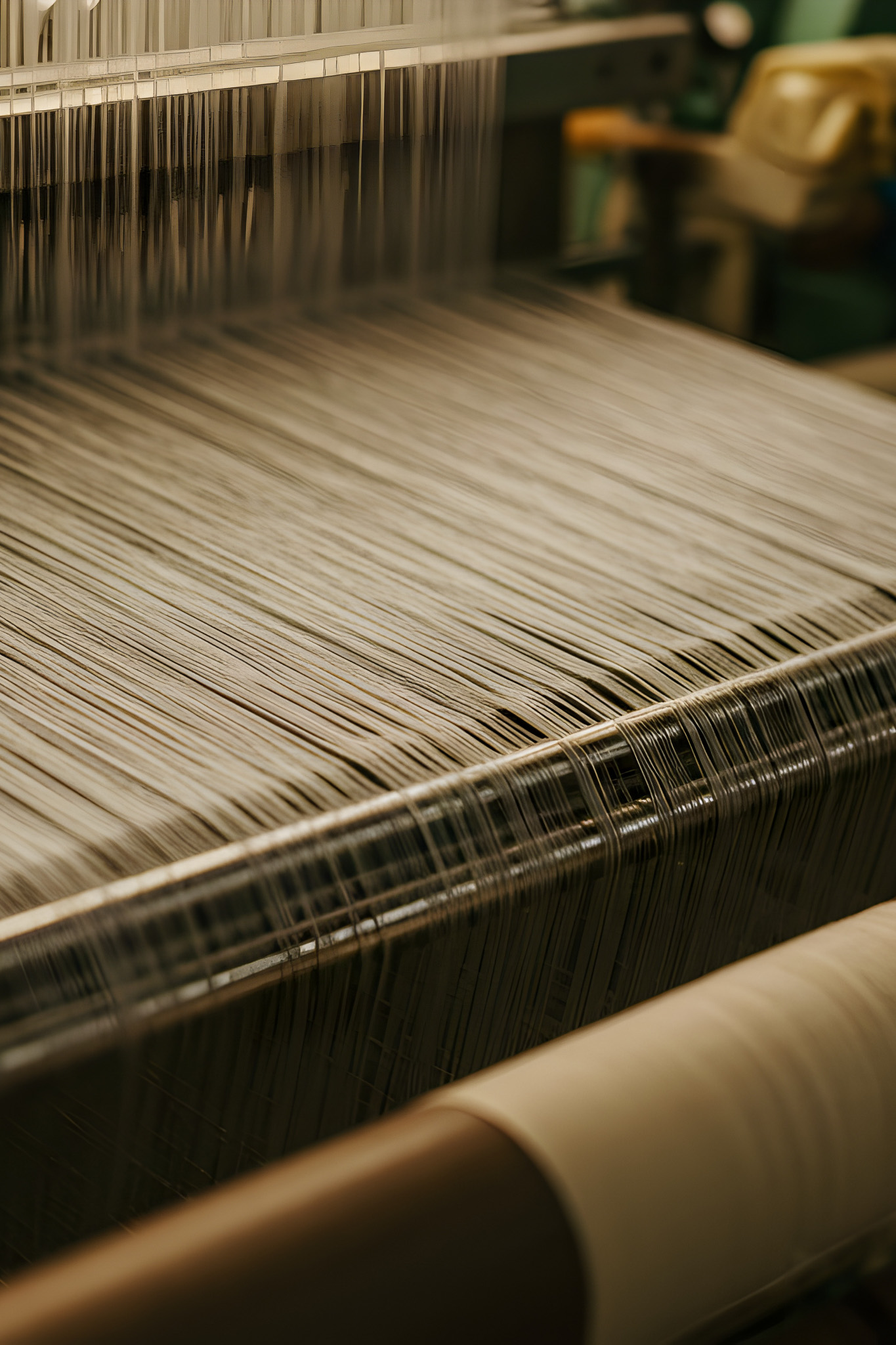 Close Up of White Thread Weaving on Industrial Loom in Textile Factory For Fabric Production